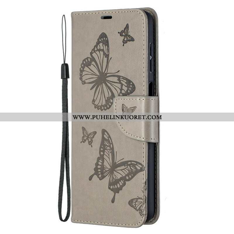 Flip Case Samsung Galaxy M12 / A12 Perhosia Lennossa Lanyardin Kanssa